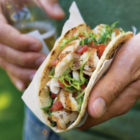 Grilled fish taco with fresh veggies, perfect for seafood lovers in Southwest Florida