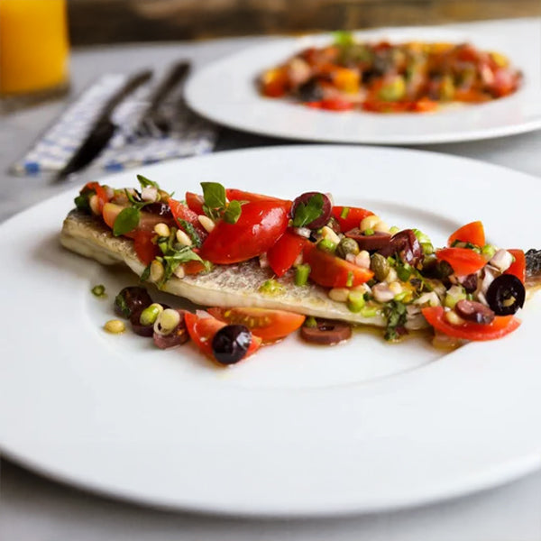 image of bronzino with tomatos olives and basil