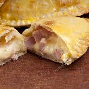 Savory seafood pie with flaky crust, filled with creamy fish and ham, served fresh from Southwest Florida